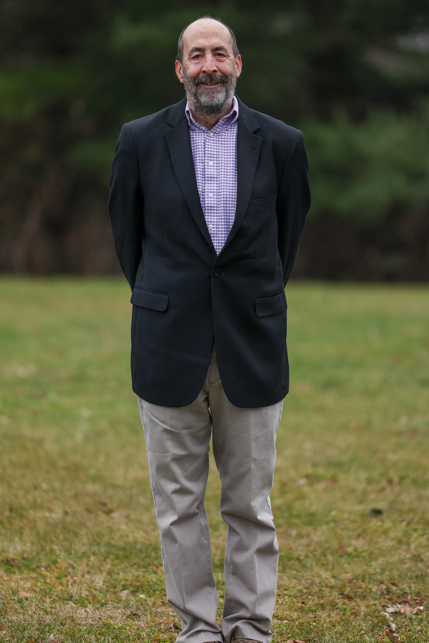 Image of Dean foley standing on the lawn wearing a sport coat