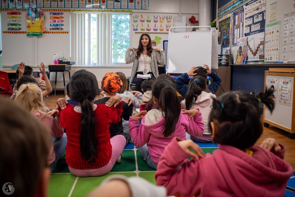 Image of Judith in front of her classroom