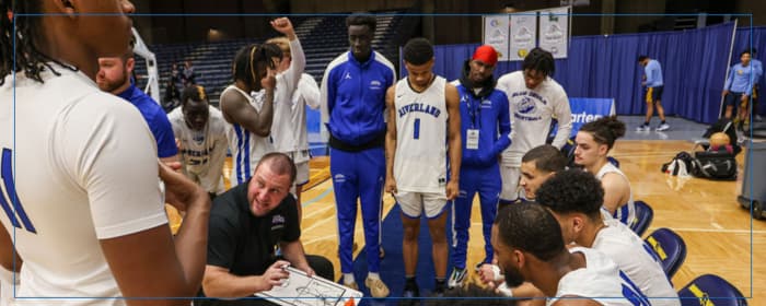 Coach Derek Hahn leading on his Blue Devil Basketball Team. 