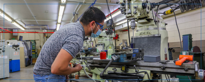 student with drilling machine